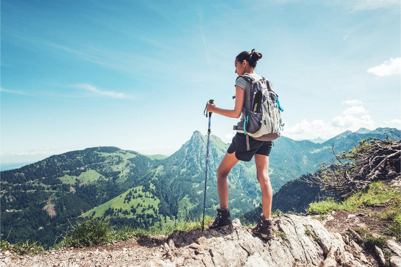 Trekking poles used on an outdoor trail