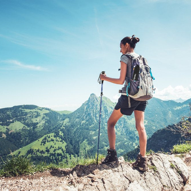 Trekking poles used on an outdoor trail